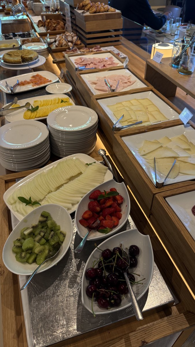 Breakfast buffet with cheese, fresh fruit and cherries at Tilia café, Arima Hotel San Sebastián