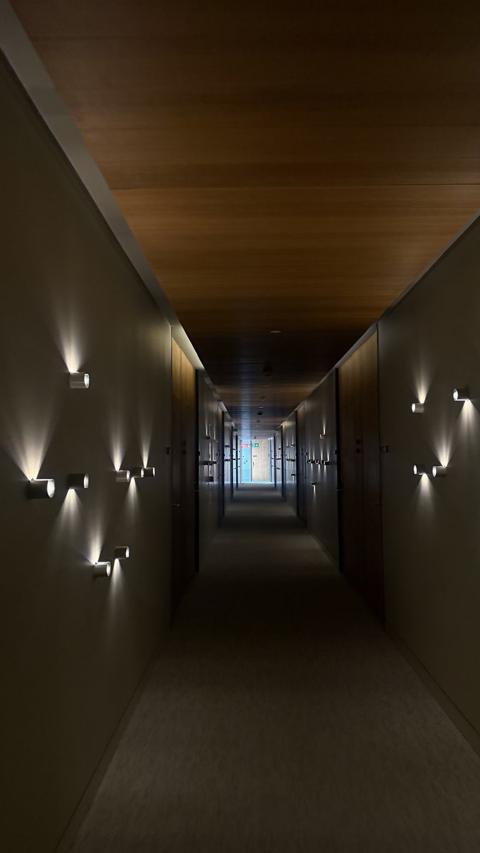 Wooden ceiling and soft wall lights in a corridor at Arima Hotel & Spa, San Sebastián