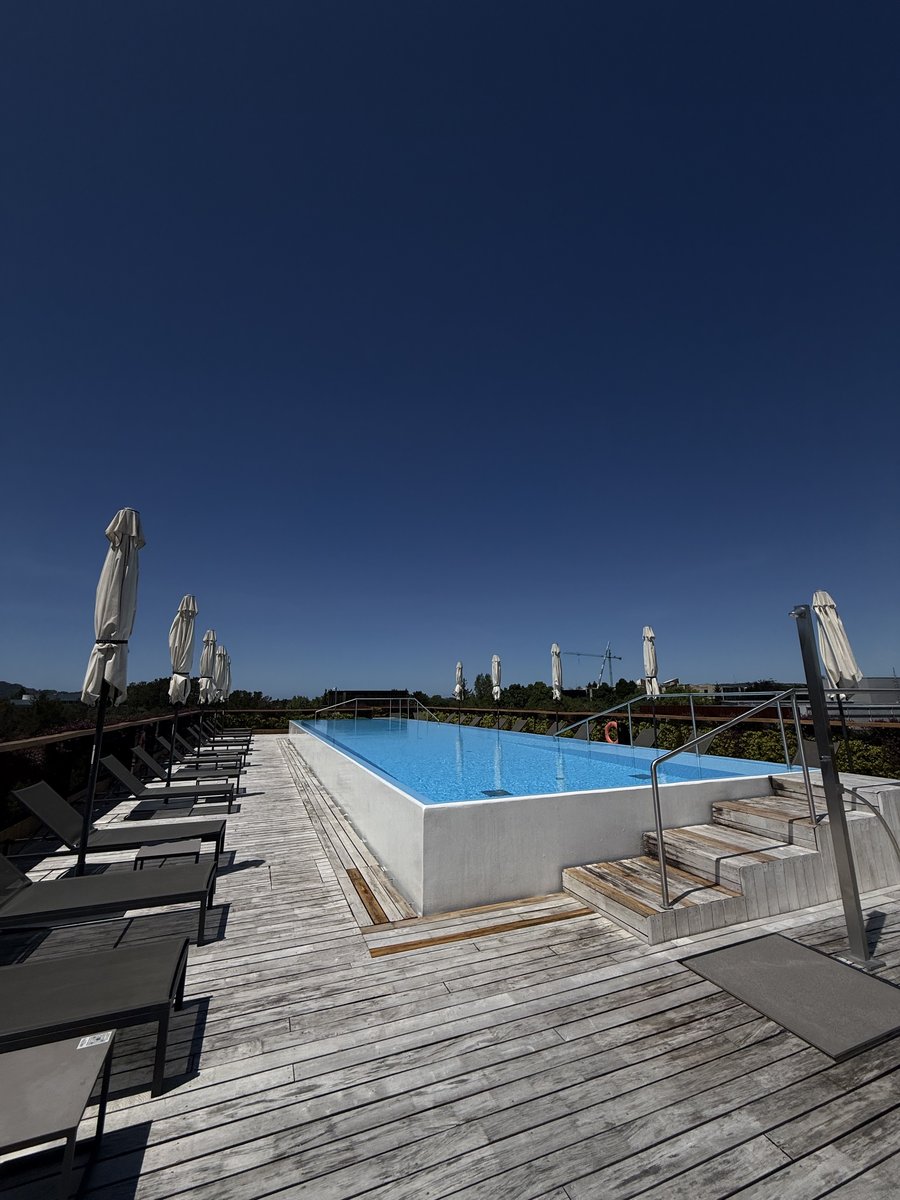 Rooftop infinity pool with sun loungers at Arima Hotel & Spa, San Sebastián