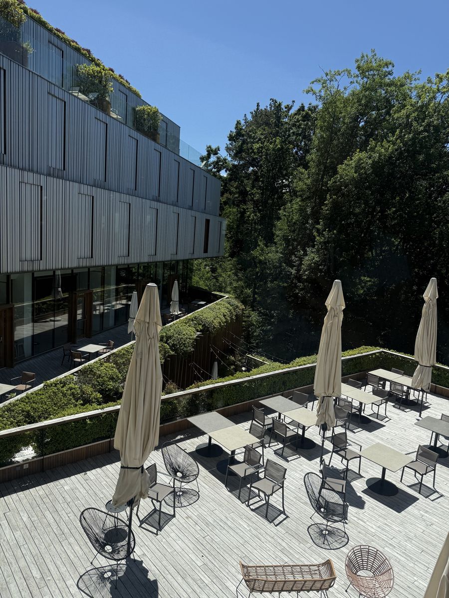 Arima Hotel terrace with umbrellas next to the Miramón forest in San Sebastián