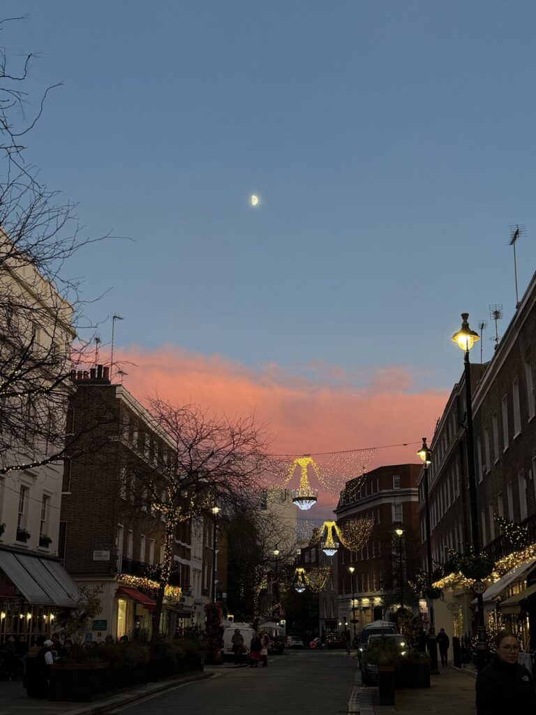 A London street at dusk with Christmas lights already up